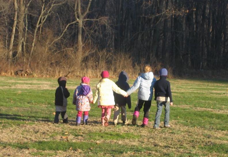 Children walking holding hands